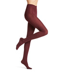 A person models Falke softmerino tights in vinröd from BUTIK KUBIK, wearing the burgundy winter tights with one leg straight and the other bent at the knee against a plain white background.