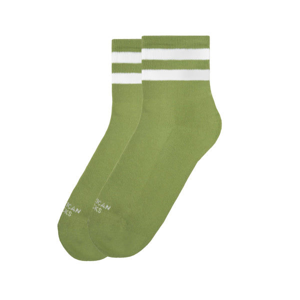 A pair of eco-friendly American socks ankle high Grogu by BUTIK KUBIK, featuring two white stripes near the cuff, crafted in Barcelona and showcased on a white background.