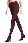A person models Falke Softmerino Tights in Barolo by BUTIK KUBIK with black high-heeled shoes against a white background, showing only their lower torso, legs, and feet.