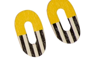Törmi lakritsi earrings medium by BUTIK KUBIK: Two oval Finnish birch plywood earrings with vertical center holes, yellow tops, and black-and-white striped bottoms. Eco-friendly and stylish, perfect for any look.