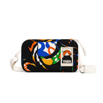 The YKRA travel MAGIC SEALIFE by BUTIK KUBIK is a colorful fabric pouch with an abstract pattern in orange, blue, green, and white on black. Perfect as a travel case for essentials, it includes a vintage YKK zipper, white adjustable strap, and small label featuring the mountain logo with YKRA.