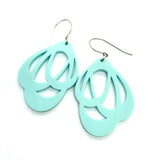 BUTIK KUBIK's Favoretro Earrings Loops Minty Green: teardrop-shaped acrylic earrings in minty green with cut-out abstract patterns and silver hooks, shown against a white background.
