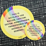BUTIK KUBIK Favoretro sticker This is no place gul: 2 round yellow premium vinyl stickers with a rainbow arc and bold text, perfect for indoor use. Text reads: THIS IS NO PLACE FOR RACISM, FASCISM, SEXISM, HOMOPHOBIA, TRANSPHOBIA OR ASSHOLES IN GENERAL.