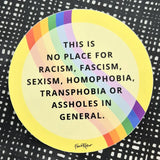 The Favoretro sticker This is no place gul by BUTIK KUBIK is a round vinyl sticker with a rainbow edge, black background, white irregular dots, and bold text against racism, fascism, sexism, homophobia, and more. Printed for indoor use on premium quality material.