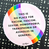 The Favoretro sticker "This is no place rosa" by BUTIK KUBIK is a circular vinyl sticker with a rainbow border and black/white pattern, made in premium quality for indoor use. It reads: THIS IS NO PLACE FOR RACISM, FASCISM, SEXISM, HOMOPHOBIA, TRANSPHOBIA OR ASSHOLES IN GENERAL.