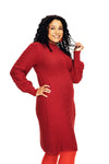 A woman with curly hair smiles while posing in the long, textured Cissi och Selma dress Svea Läppstift from BUTIK KUBIK and red leggings against a white background.